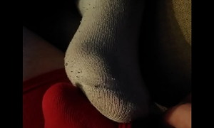 Friend Elise rubbing her dirty socked feet on my dick