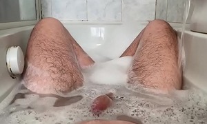 24 year elderly wide the bathtub playing involving her feet and cock